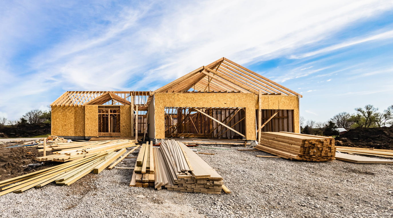 Inventory management for construction projects | B3 Software picture of home frame construction zone with inventory on front lawn