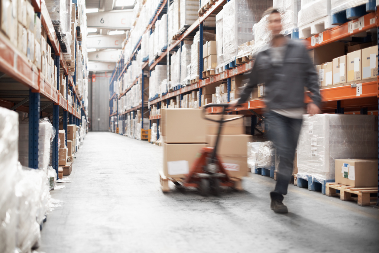 Field service worker rushing with a pallet of boxes